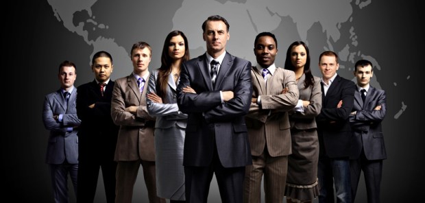 Businessmen standing in front of an earth map